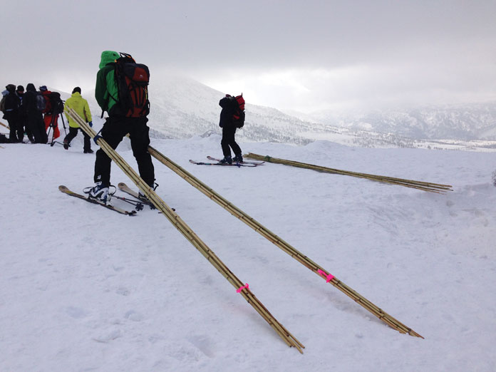 Guides poling out backcountry routes at Hakkoda