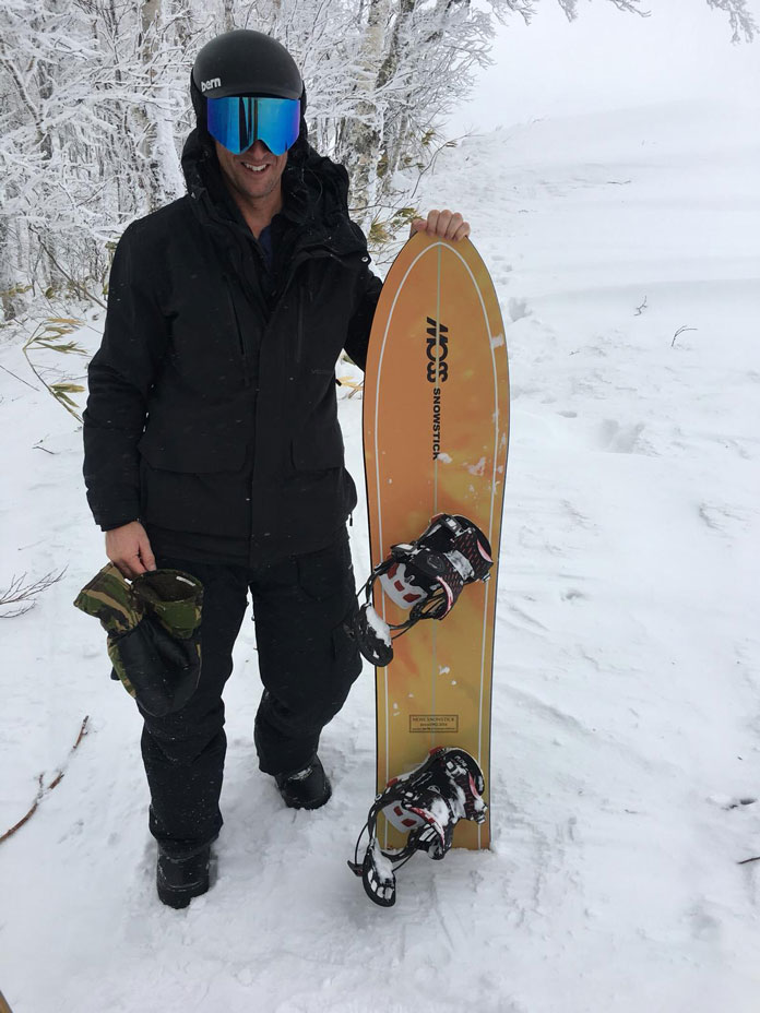 Showing the MOSS Snowstick board on snow in Hokkaido