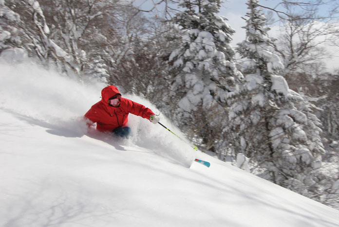 Riki Nakajima skiing waist deep powder at Grndeco in the Aizu Region