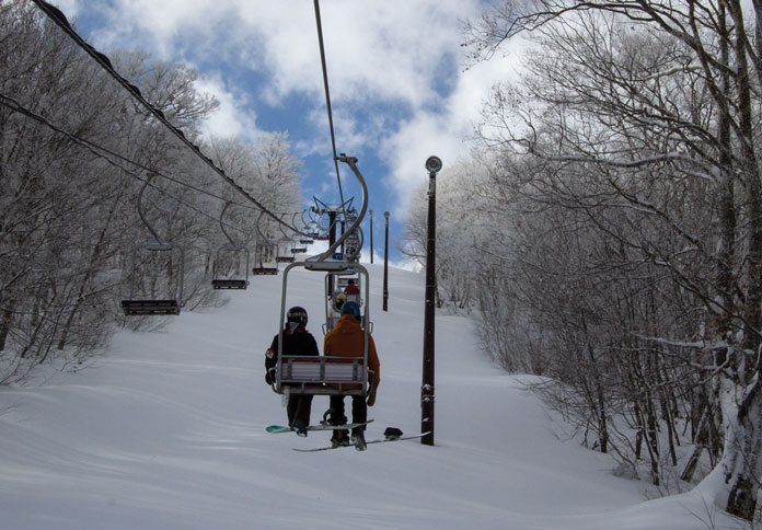 Lonely riding chairlift at Nekoma