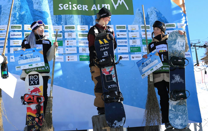 Tess Coady on top of podium at Seiser Alm Slopestyle World Cup