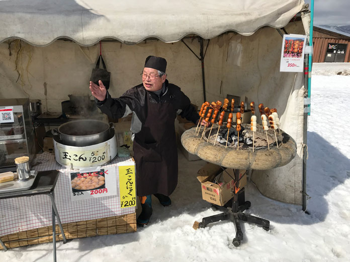Barbecued rice balls and miso paste stall at Numajiri ski area, Aizu