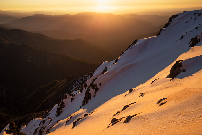 Sunset ski line in Watsons Crags, the steepest runs along the Main Range