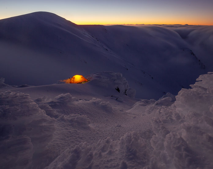 Night falls over snow camp on the Main Range