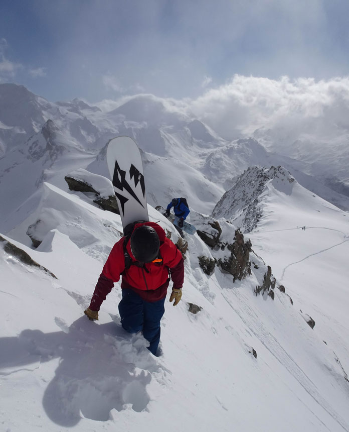 Warren Miller Timeless Swiss segment, boarders hiking knife edge ridge in Switzerland