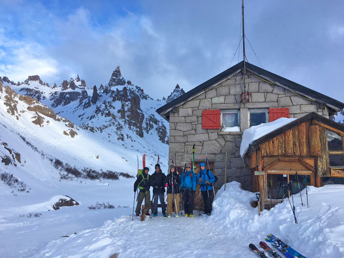 Group of skiers head out from Refugio Frey
