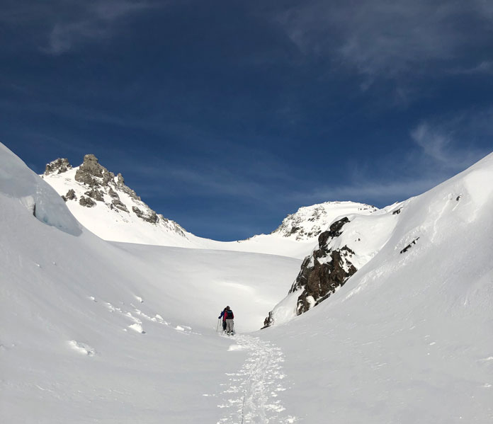Skiers skinning towards Refugio Jakob Bariloche