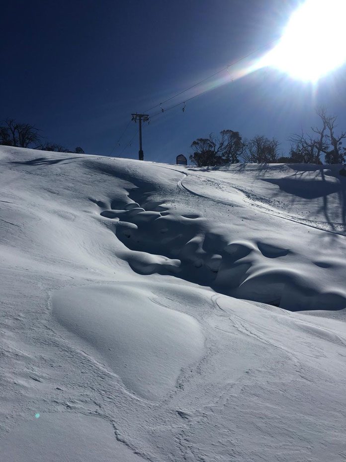 Windblown week snow on Sponar's liftline at Thredbo