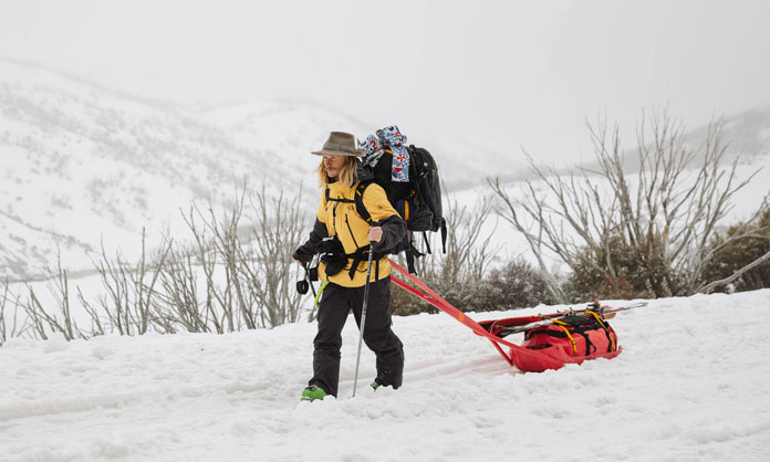 Hank Bilous heads out towing sled at start of filming the North Face 'Western Faces' short movie