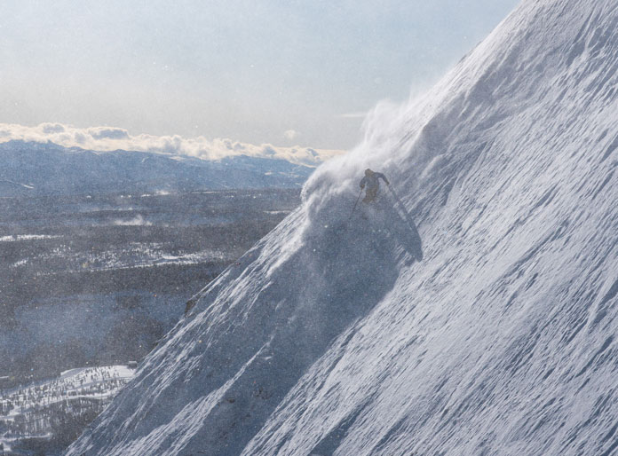 Scot Schmidt smashing a steep Montana line in Warren Miller's Future Retro