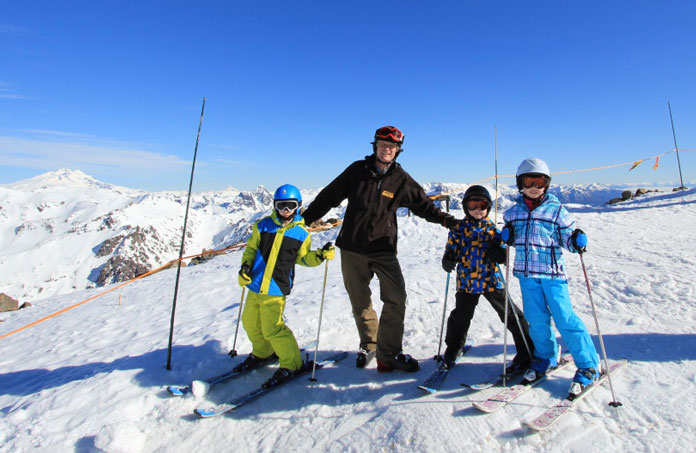 Three kids in Aldi snow gear at Cerro Catedral, Argentina