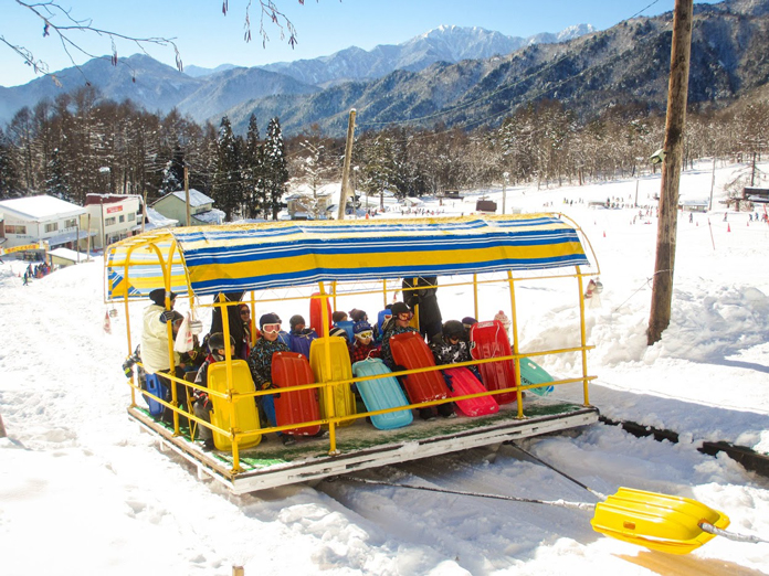 Troika Lift full of excited kids at Hakuba Jigatake Snow Resort
